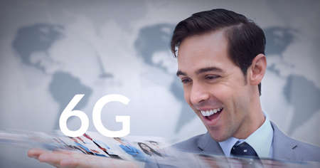 Composition of the word 6g over caucasian man smiling with world map in background. global technology, digital interface, connection and communication concept digitally generated imageの写真素材