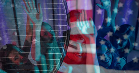 Composition of american flag over group of smiling female friends. american patriotism, culture and celebration concept digitally generated image.の写真素材