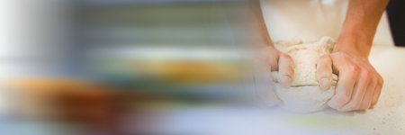 Chef kneading dough in a kitchen, restaurant kitchen and food industry concepts. digitally generated imageの写真素材