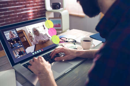 Photography apps against midsection of creative editor typing on laptopの写真素材