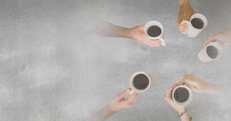 Composition of grey background over group of diverse friends holding mugs of coffee. global business, finance and networking concept digitally generated image.の写真素材