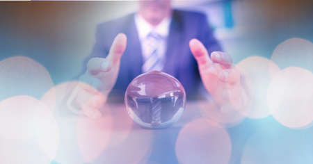 Composition of light circles over caucasian businessman with globe. global business, finance and networking concept digitally generated image.の写真素材
