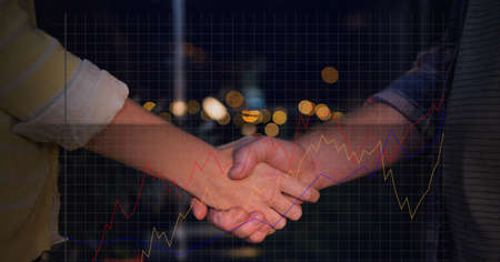 Composition of financial data processing over businessman and businesswoman handshake. global...