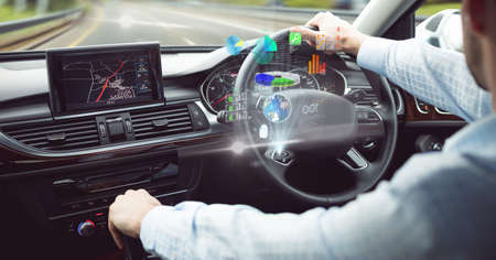 Composition of data processing on interactive screen over businessman driving car. business, technology and digital interface concept digitally generated image.の写真素材