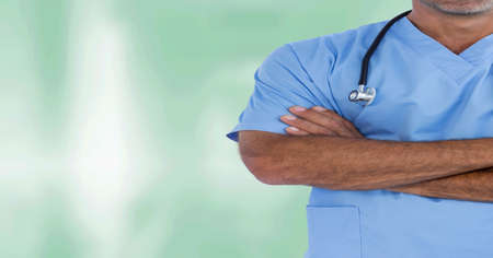 Composition of midsection of male surgeon in scrubs and stethoscope with copy space. medicine and...