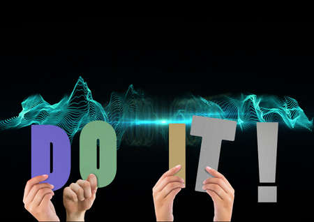 Composition of do it text in multi coloured letters held by people with green light trails....