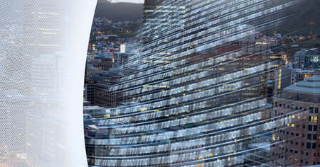 Composition of binary coding over cityscape and white edge. global business, connections and technology concept digitally generated image.の写真素材