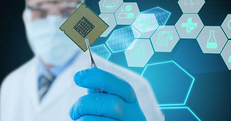 Composition of male doctor holding processor over virtual screen with medical icons. global medicine...