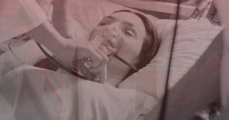 Composition of medical data processing over female patient with oxygen mask checked with...