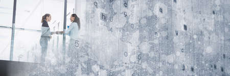 Composition of letters processing over businesswoman handshake in background. global business finance negotiation and success concept digitally generated image.の写真素材