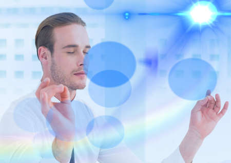 Composition of businessman with eyes closed meditating with blue spots of light in background....
