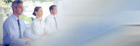 Several businessman practicing meditation and relaxing at the office with office background concept. digitally generated image.の写真素材