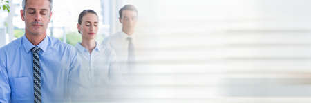 Several businessman practicing meditation and relaxing at the office with office background concept. digitally generated image.の写真素材