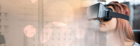 Gold sparkling transition over a woman using vr headset, virtual reality concept. digitally...