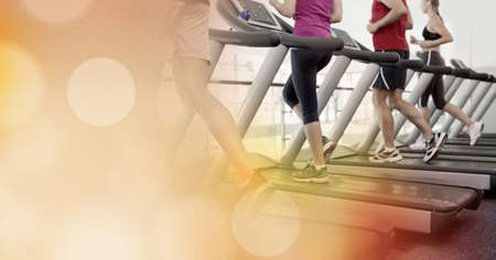 Composition of people running on treadmill spots of light. exercise and active lifestyle concept...
