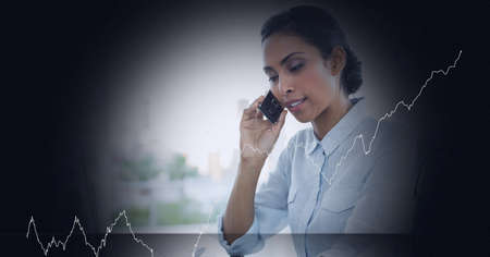 Mid section of caucasian businesswoman talking to smartphone against black background at the office....
