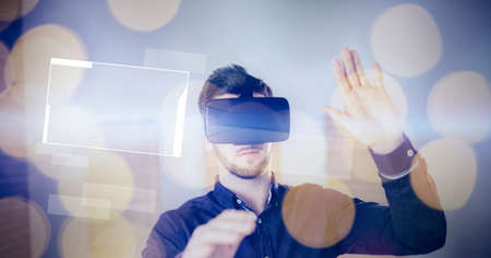 Composition of businessman wearing vr headset touching digital screen. global connections,...