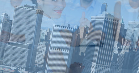 Composition of smiling businesswoman and colleagues over modern cityscape. global business,...
