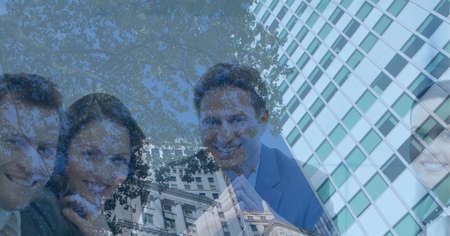 Composition of smiling business people in meeting over modern building. global business, success and...