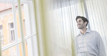 Composition of smiling businessman standing in office with double exposure. global business,...