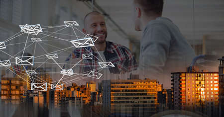 Composition of network of email icons over two businessmen talking in office and cityscape. global...