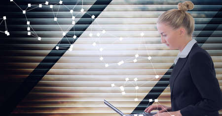 Composition of network of connections over businesswoman using laptop in office. global networks and...