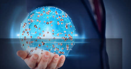 Globe of network of profile icons over hand of businessman against blue background. global...