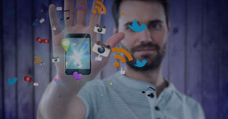 Multiple digital icons over smartphone against caucasian man scanning his hand on invisible screen....