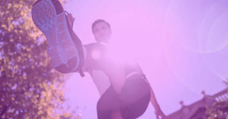 Composition of man running with glowing light and pink tint. sport, fitness and active lifestyle...