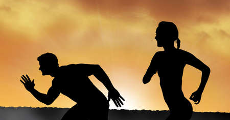 Composition of athletic male and female silhouettes running over sunset. sport, fitness and active lifestyle concept digitally generated image.の写真素材