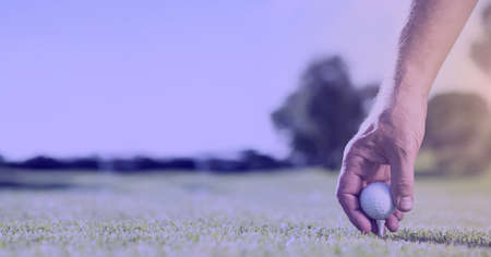 Composition of athletic male golf player over light blur. sport, fitness and active lifestyle concept digitally generated image.の写真素材