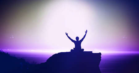 Composition of fit man sitting and raising hands over light blur. sport, fitness and active lifestyle concept digitally generated image.の写真素材