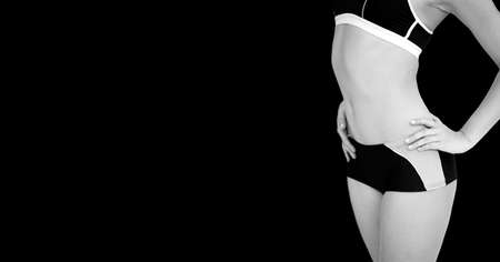 Composition of athletic woman posing on black background. sport, fitness and active lifestyle concept digitally generated image.の写真素材