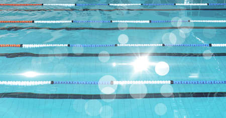 Composition of clean water in swimming pool over light blur. sport, fitness and active lifestyle...