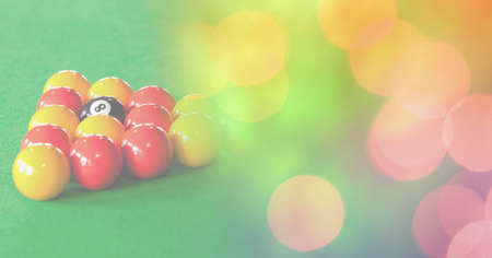 Composition of snooker balls on snooker table with orange and yellow spots in background. sport,...