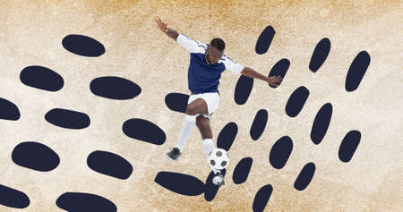 Composition of football player with ball over grey spots on concrete surface. sports event and...