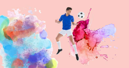 Composition of football player with ball over colourful splodges and pink background. sports event and competition concept digitally generated image.の写真素材