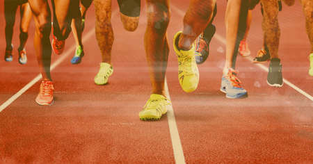 Composition of legs of running male athletes on racing track. sport and competition concept...