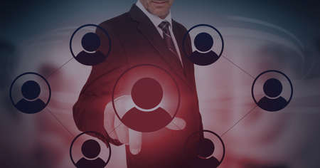 Composition of businessman touching interactive screen with icons. global networks and digital interface concept digitally generated image.の写真素材