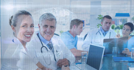 Composition of medical data processing over smiling male and female doctors in meeting. medicine,...