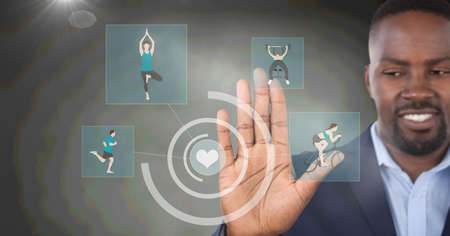 Composition of smiling businessman touching screen with sports digital icons. sport, digital interface, technology and communication concept digitally generated image.の写真素材