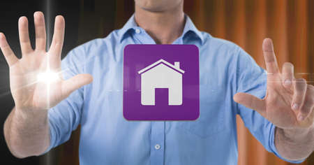 Composition of smiling businessman touching screen with digital home icon. business, technology,...