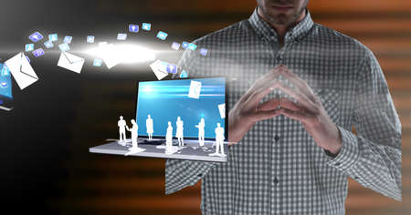 Composition of businessman using interactive screen with laptop and digital icons. global...