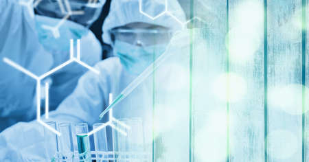 Composition of scientists in ppe suits with test tubes working in laboratory and chemical compounds....