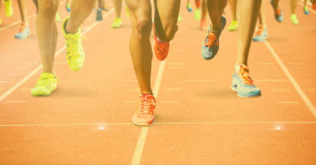 Composition of legs of athletes running on racing track. sports and competition concept digitally...