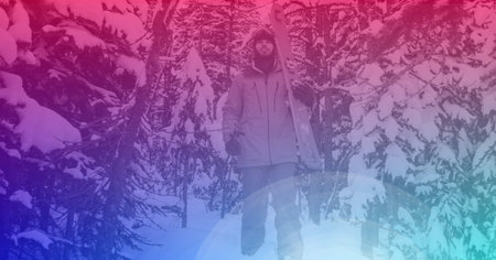Composition of male skier carrying skis in mountains with pink tint. sport and active outdoor lifestyle concept digitally generated image.の写真素材