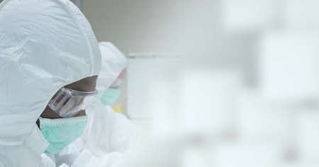 Composition of scientist in ppe suit working in laboratory and copy space. research and science...