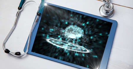 Composition of stethoscope and tablet on desk with virtual medical research data interface screen....