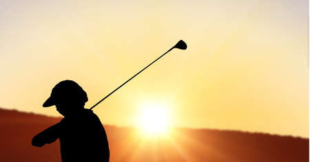 Composition of silhouette of golf player over landscape and sun setting with copy space. sport and competition concept digitally generated image.の写真素材