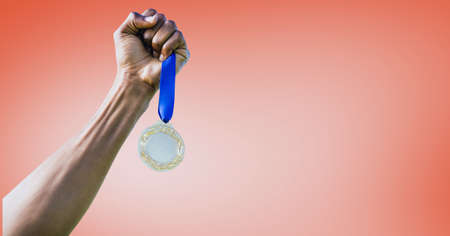 Composition of caucasian male athlete holding gold medal with copy space on red background. sport,...